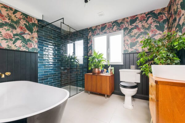 Bathroom Loft Conversion | Decorative Wallpaper | Tiled Shower | Squared Black steel Shower Door | Simple Loft